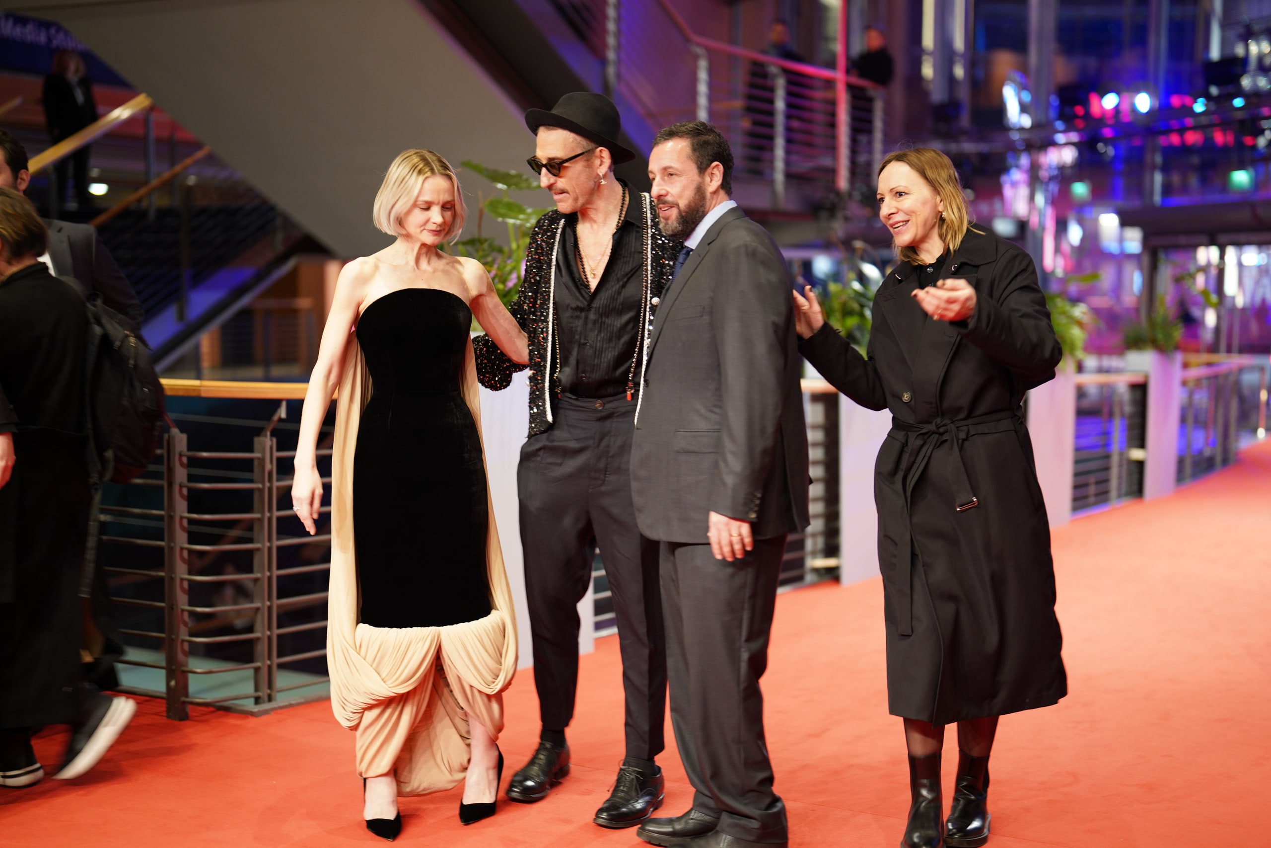 Members of the Spaceman team sharing a light moment as they walk the Berlinale red carpet.