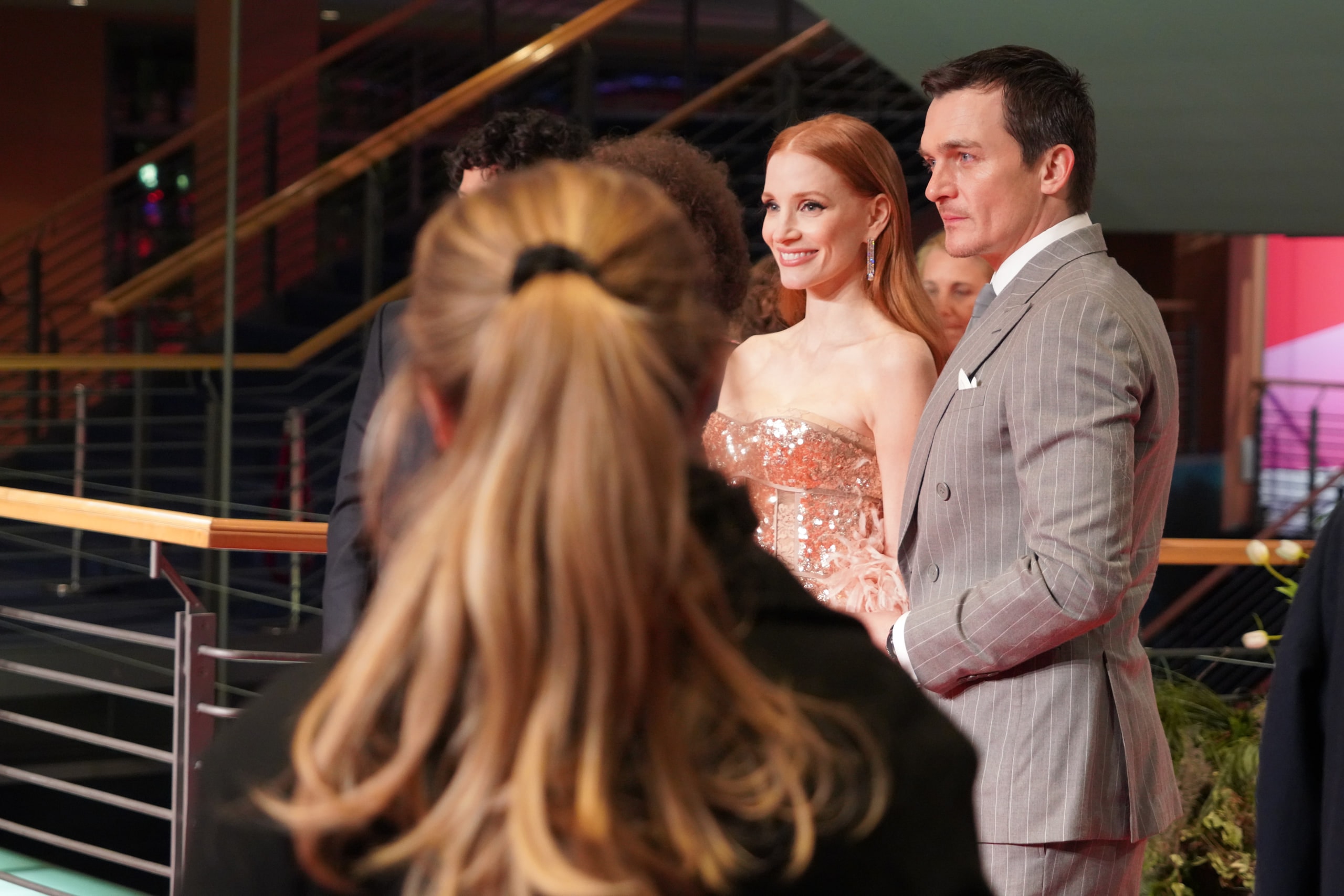 Jessica Chastain and Rupert Friend posing together on the Berlinale red carpet.