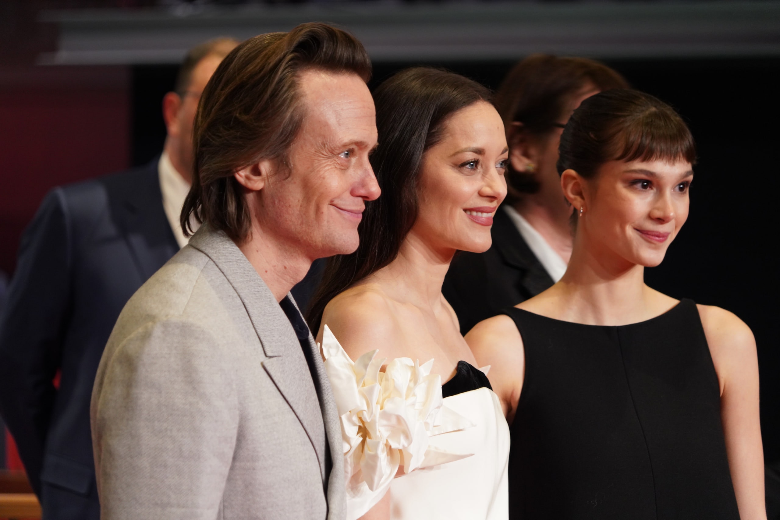 August Diehl, Marion Cotillard and Clara Pacini posing together on the Berlinale red carpet.