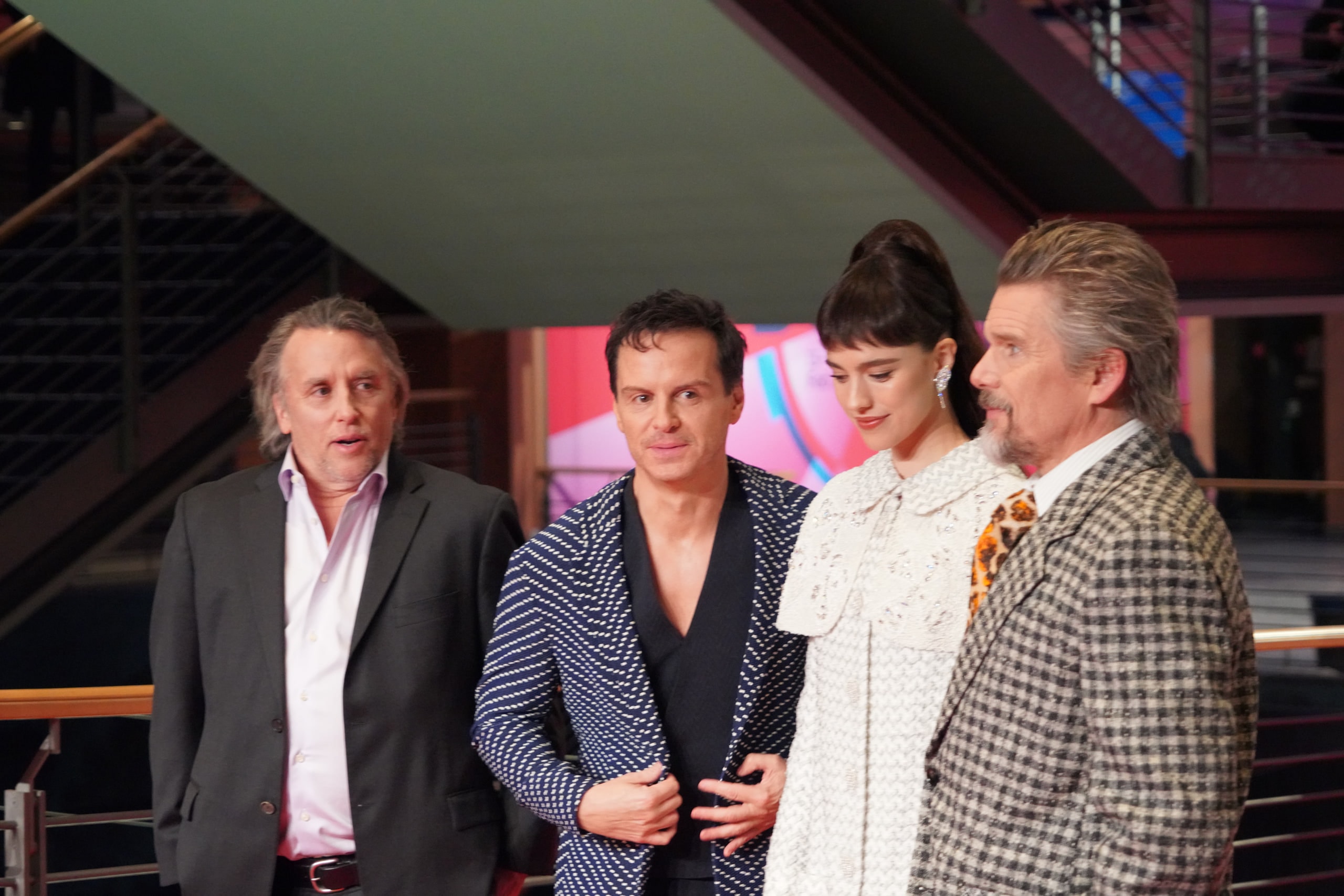 Four members of the Blue Moon team standing together at the top of the red carpet.