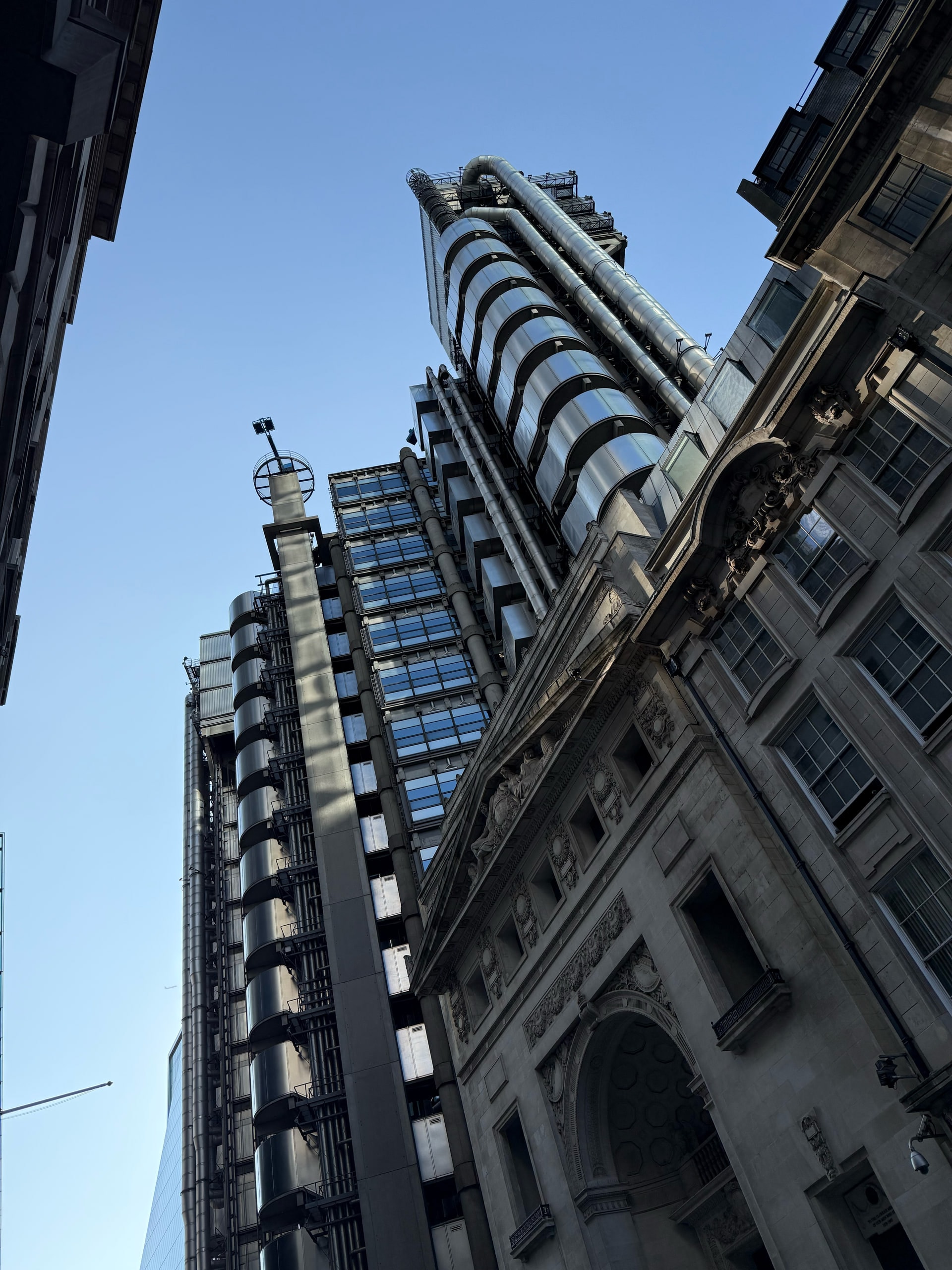 The Lloyd's building rising behind a classical stone facade.