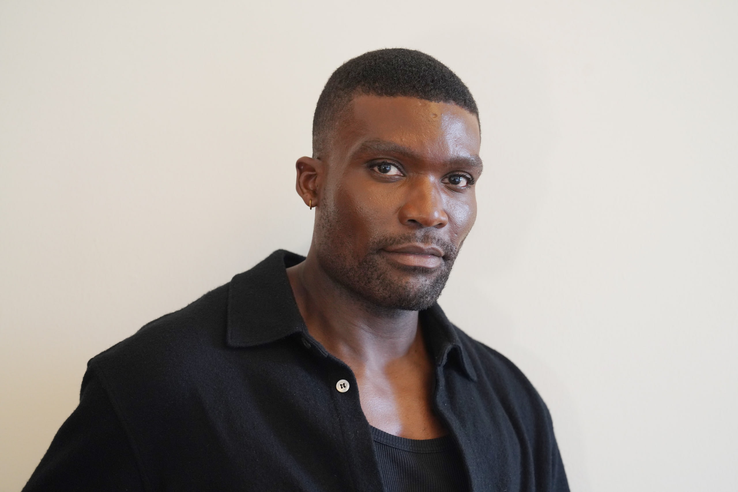 Michael Solomon turned slightly toward the camera in a black shirt.